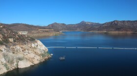 The San Vicente reservoir in San Diego County stores water from as far away as the Colorado River. Pumping water into a smaller reservoir in the surrounding mountains could store excess solar power until it's needed, when the sun sets.