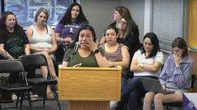 Nora Morales, a parent in the Waukee Community School District, is Mexican American. She wiped away tears as she asked the school board to take action after a student presentation used offensive images and language to describe immigrants in Iowa.