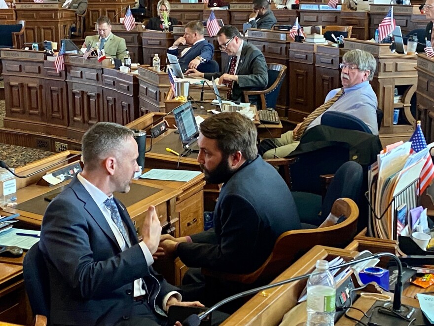 Sen. Dan Dawson and Rep. Bobby Kaufmann talk in the Iowa House