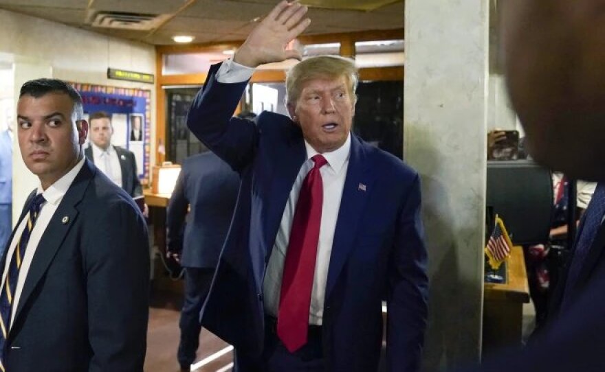 Former President Donald Trump waves.