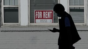 FILE - In this Oct. 20, 2020 file photo, a man walks in front of a For Rent sign in a window of a residential property in San Francisco. The Biden administration on Friday, May 7, 2021, announced the allocation of $21.6 billion to provide emergency rental assistance to help prevent evictions of people who lost jobs during the pandemic.