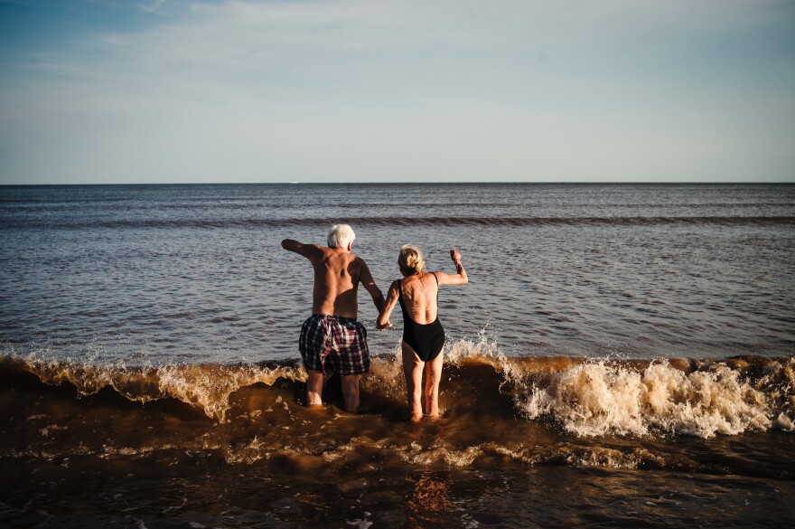 A couple holding hands on Pocitos Beach on January 22, 2016, in Montevideo, Uruguay, captivated the photographer.