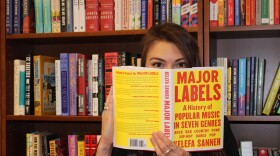 Iowa singer/songwriter and book worm Lily DeTaeye at Beaverdale Books in Beaverdale. She read and reviewed the book "Major Labels" for IPR's music blog, the B-Side.