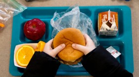   A student at Oakville Elementary School eats his lunch. Preliminary data on the national lunch program shows schools served almost 130 million fewer free or reduced price meals in the fall of 2022 compared to the same time period right before the pandemic. 