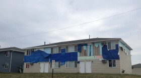 Apart from being tarped over, damaged apartment units at the Westdale Court complex on the southwest side of Cedar Rapids look almost unchanged since the days after the derecho hit on August 10, 2020.